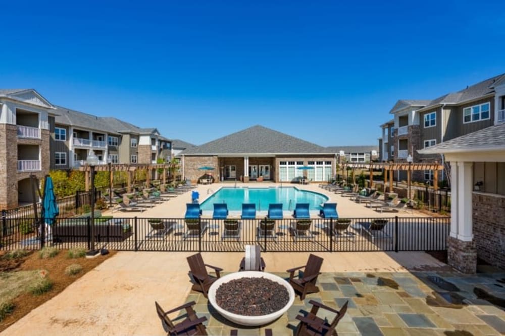 Aerial view of firepit and resort-inspired pool at Haywood Reserve Apartment Homes in Greenville, South Carolina
