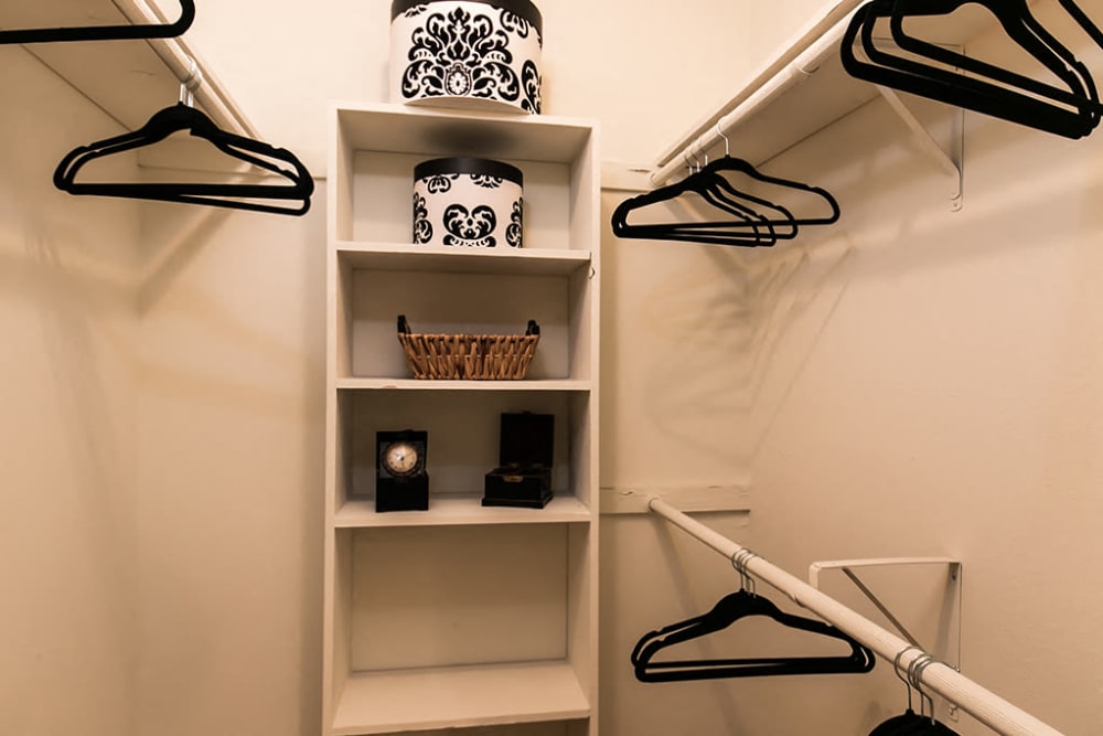Interior of a walk-in closet with built-in shelving at The Waterford Apartments in Columbia, South Carolina