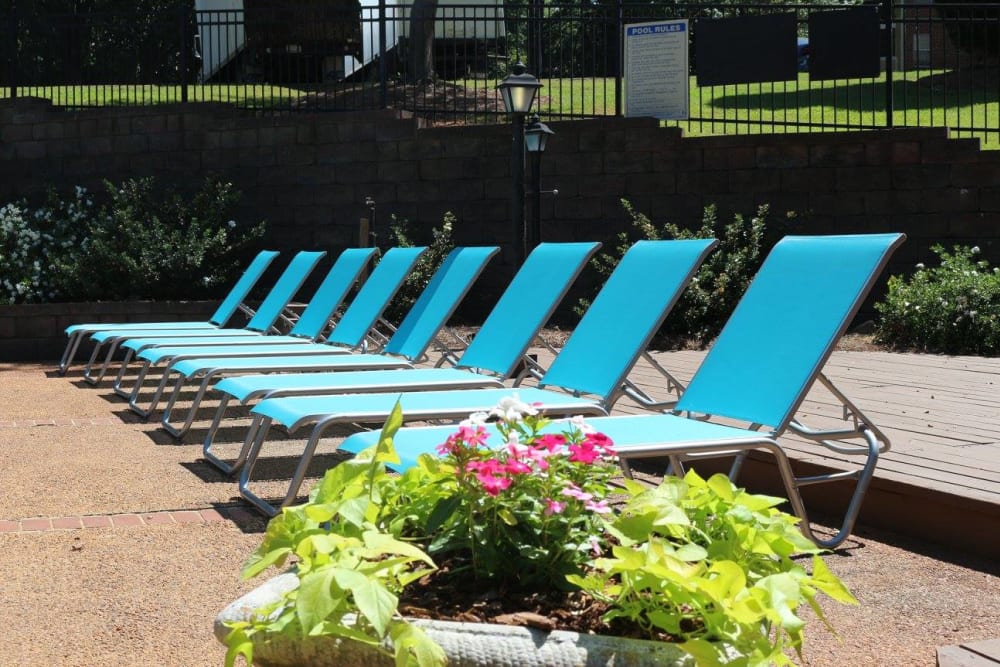 Comfortable lounge chairs on the sunny pool deck of The Waterford Apartments in Columbia, South Carolina