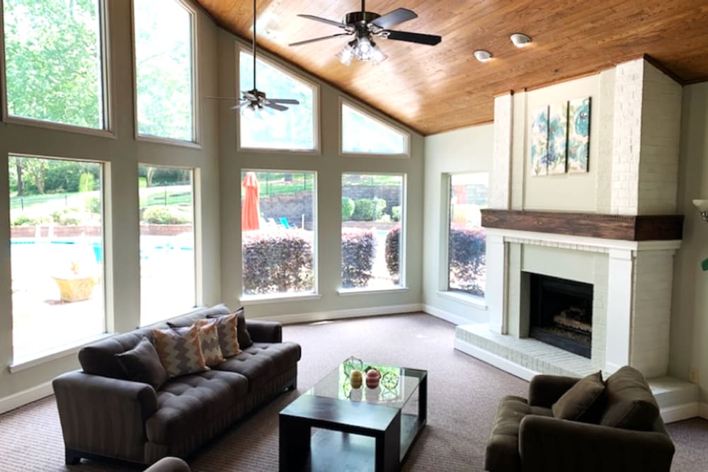 Resident clubhouse with vaulted ceilings and a fireplace at The Waterford Apartments in Columbia, South Carolina