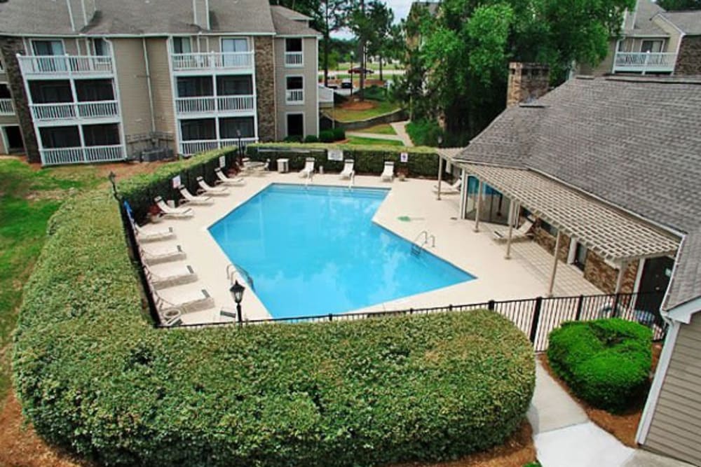 Swimming pool surrounded by lounge chairs at Gable Hill Apartment Homes in Columbia, South Carolina