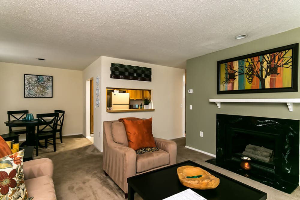 Living room with a fireplace in a model apartment home at Gable Hill Apartment Homes in Columbia, South Carolina
