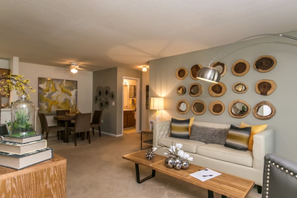 Spacious open concept living room and dining room in a model home at St. Andrews Commons Apartment Homes in Columbia, South Carolina