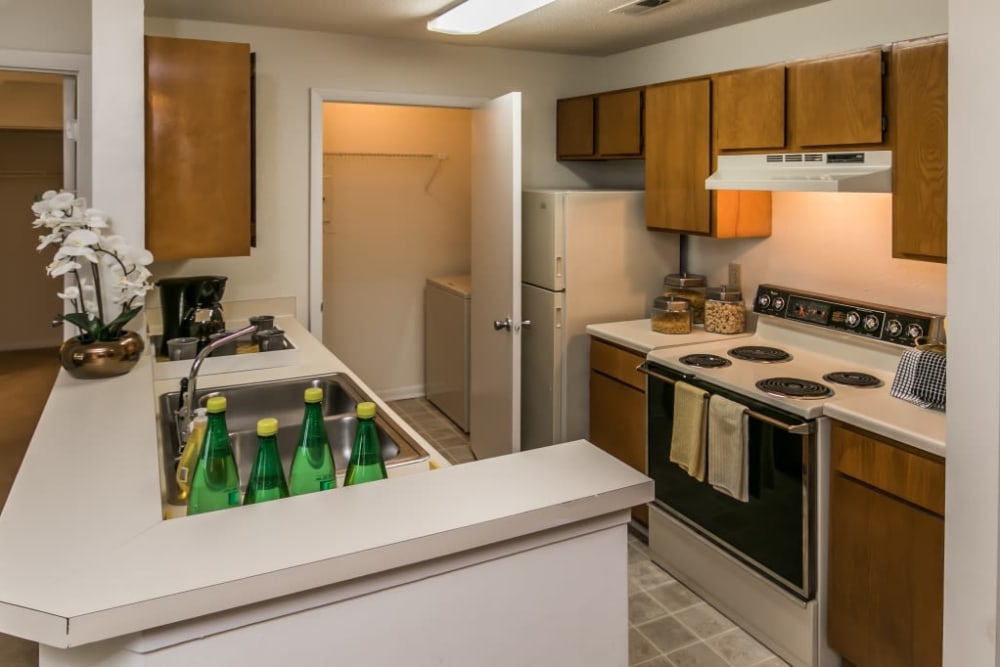 Fully equipped kitchen and a laundry room with washer and dryer included at St. Andrews Commons Apartment Homes in Columbia, South Carolina