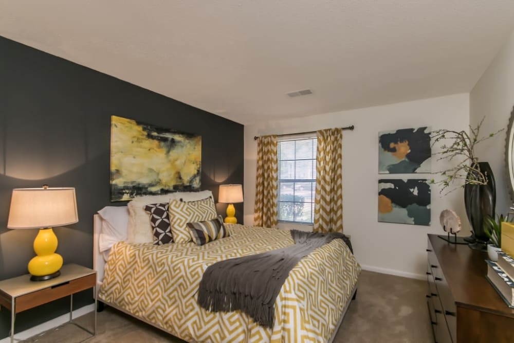 Model bedroom with black accent at St. Andrews Commons Apartment Homes in Columbia, South Carolina.