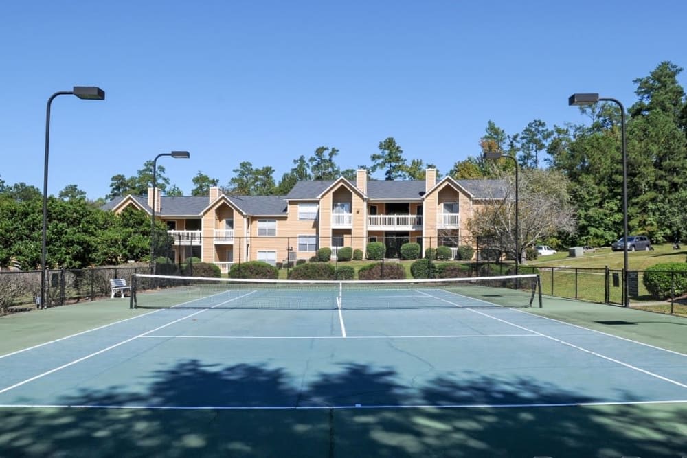 Tennis court with lights at Hampton Greene Apartment Homes in Columbia, South Carolina