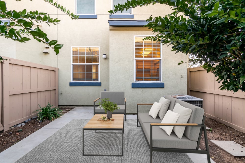 Furnished patio area outside of a home at The Village at Serra Mesa in San Diego, California