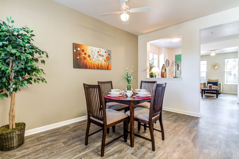 A furnished dining room in a home at The Village at Serra Mesa in San Diego, California
