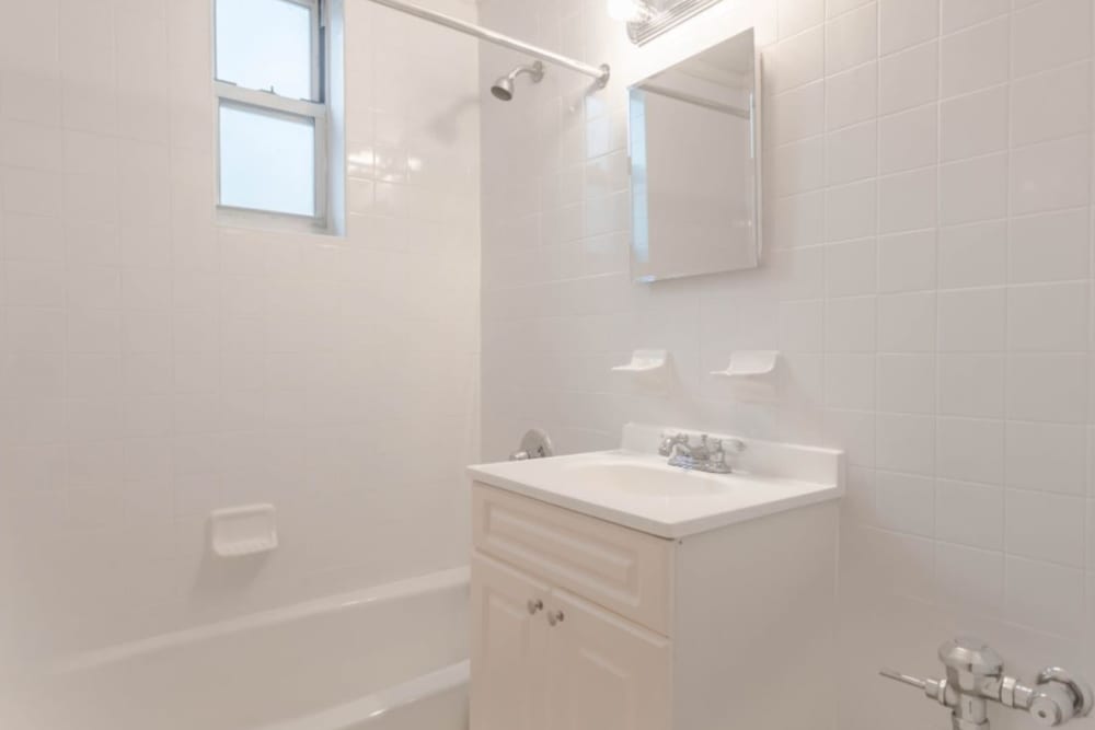 Cute bathroom with a small vanity mirror to get ready with at Eastgold Westchester in Dobbs Ferry, New York