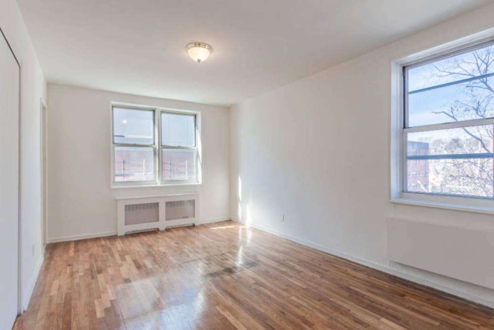 Bedroom with lots of light and nice hardwood style flooring at Eastgold Westchester in Dobbs Ferry, New York