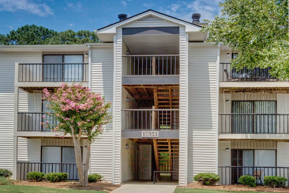 Exterior with private patio and lush lawn at Morganton Place Apartment Homes in Fayetteville, North Carolina