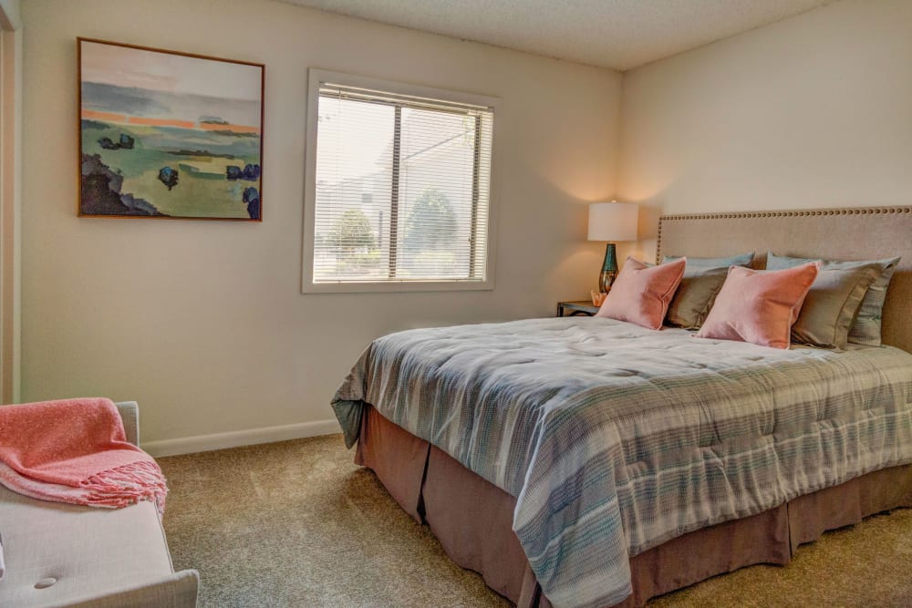 Model bedroom with plush carpeting at Morganton Place Apartment Homes in Fayetteville, North Carolina