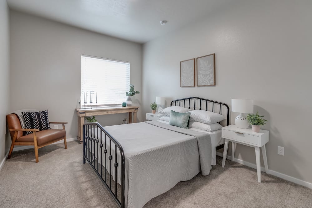 Spacious model bedroom with plush carpeting at Olympus at Ten Mile in Meridian, Idaho