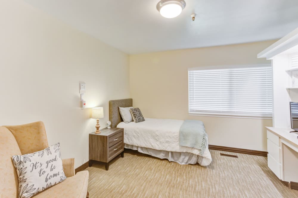 Bedroom with carpet floors at Truewood by Merrill, Taylorsville in Taylorsville, Utah
