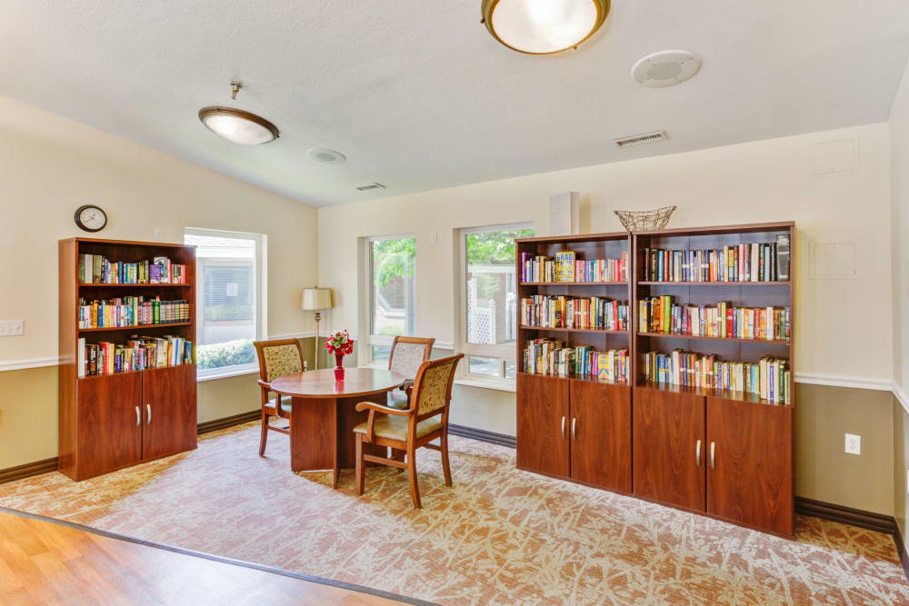 Bright room with multiple bookshelves at Truewood by Merrill, Taylorsville in Taylorsville, Utah