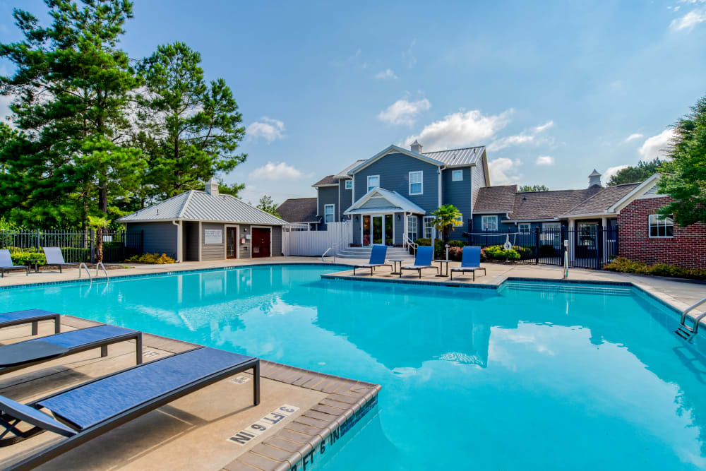 Swimming pool with view of exterior blue building at The Park at Riverview in Atlanta, Georgia 