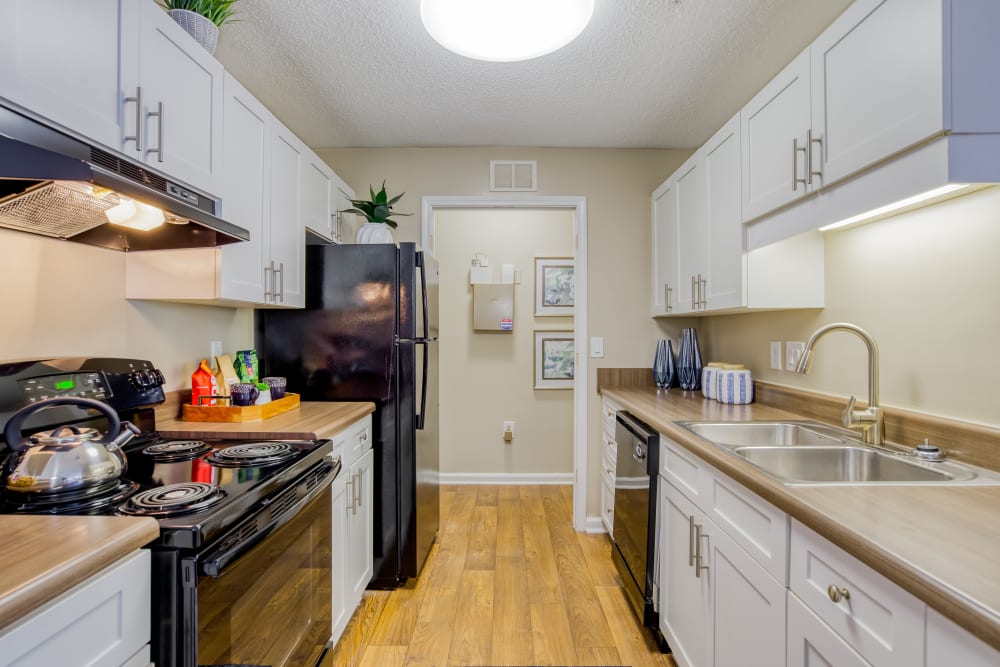 Model Kitchen with white cabinetry at The Park at Riverview in Atlanta, Georgia 