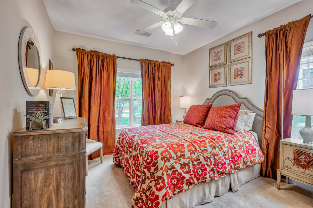 Bedroom with large windows at Oasis at Montclair Apartments in Dumfries, Virginia