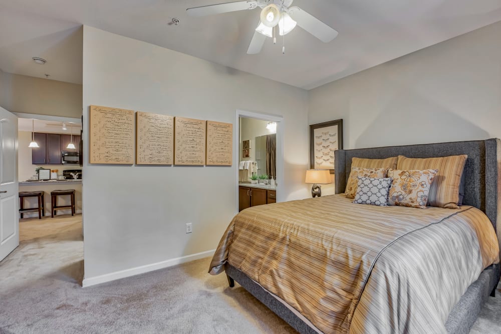 Bedroom with walk-in closet at Oasis at Montclair Apartments in Dumfries, Virginia