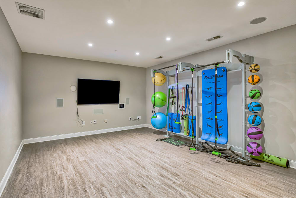 Fitness center with separate yoga and spin room at Oasis at Montclair Apartments in Dumfries, Virginia