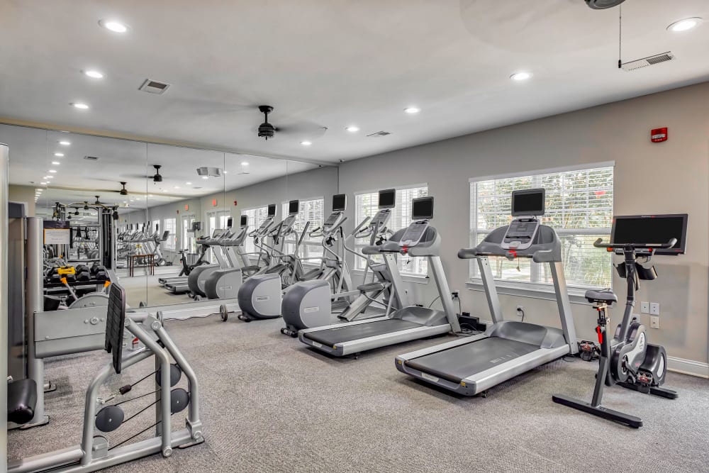 Fitness Center with cardio equipment and weights at Oasis at Montclair Apartments in Dumfries, Virginia