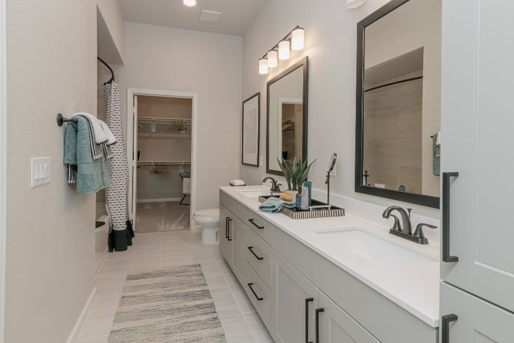 Modern bathroom with 2 sinks at Vidorra McKinney Avenue in Dallas, Texas