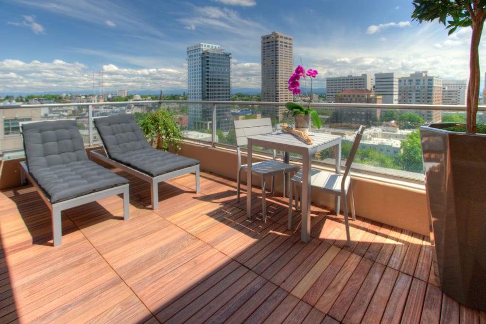 Private balcony with wood flooring at Panorama Apartments in Seattle, Washington