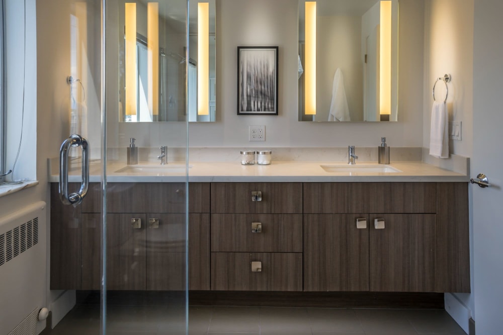Modern dual vanity bathroom at Panorama Apartments in Seattle, Washington
