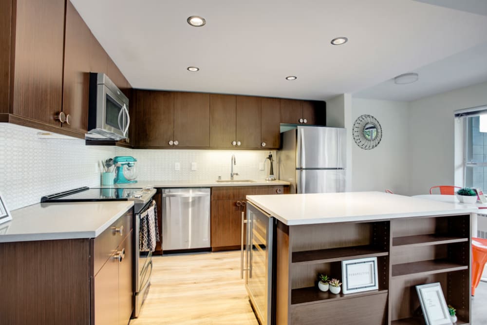Kitchen with white quartz countertops at Panorama Apartments in Seattle, Washington