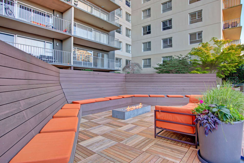 Community lounge area with fire pits at Panorama Apartments in Seattle, Washington