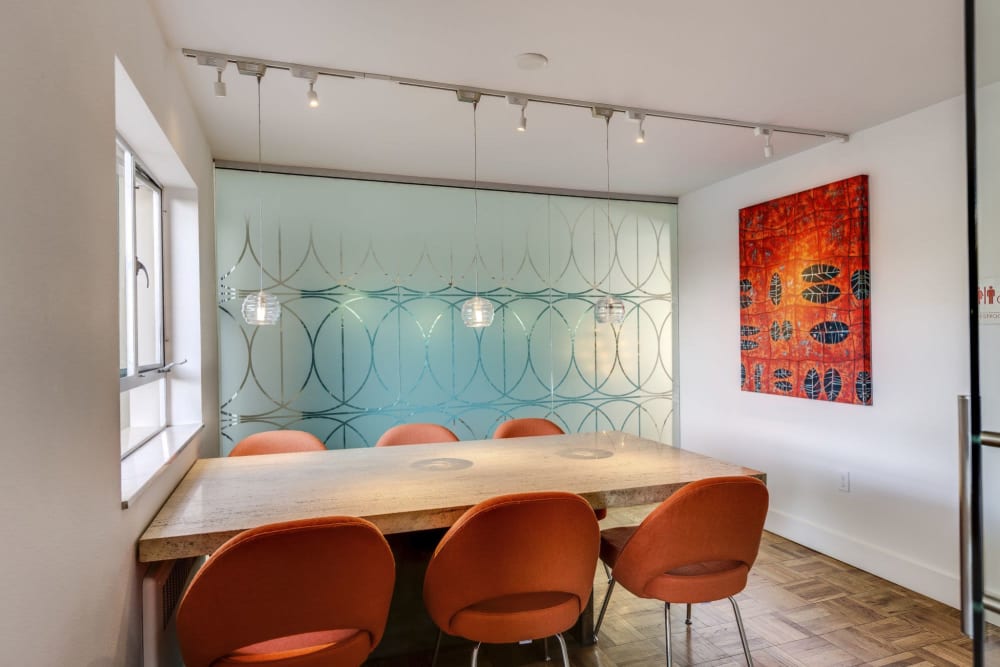 Community seating area with a table for work at Panorama Apartments in Seattle, Washington