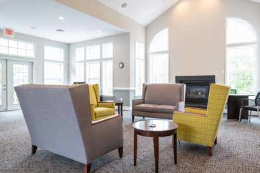 Big and cozy chairs in the common area where residents can relax in at The Village of Churchills Choice in Upper Marlboro, Maryland
