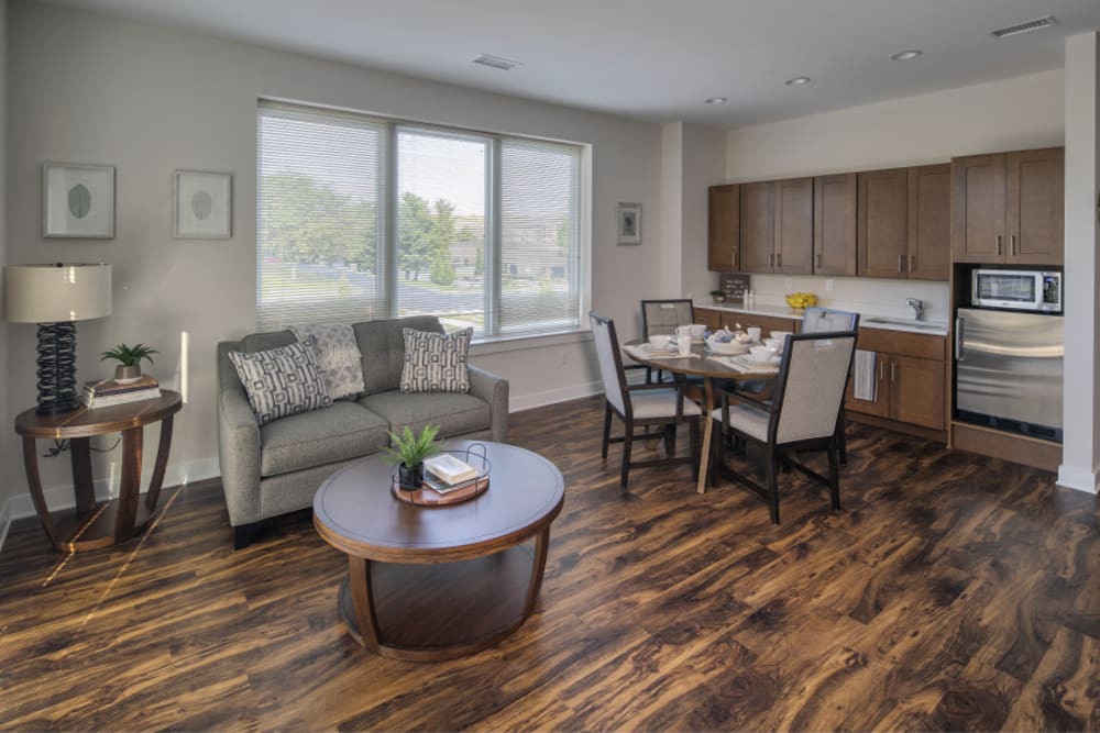 Interior of apartment with hardwood floors and seating at Eagleview Landing in Exton, Pennsylvania