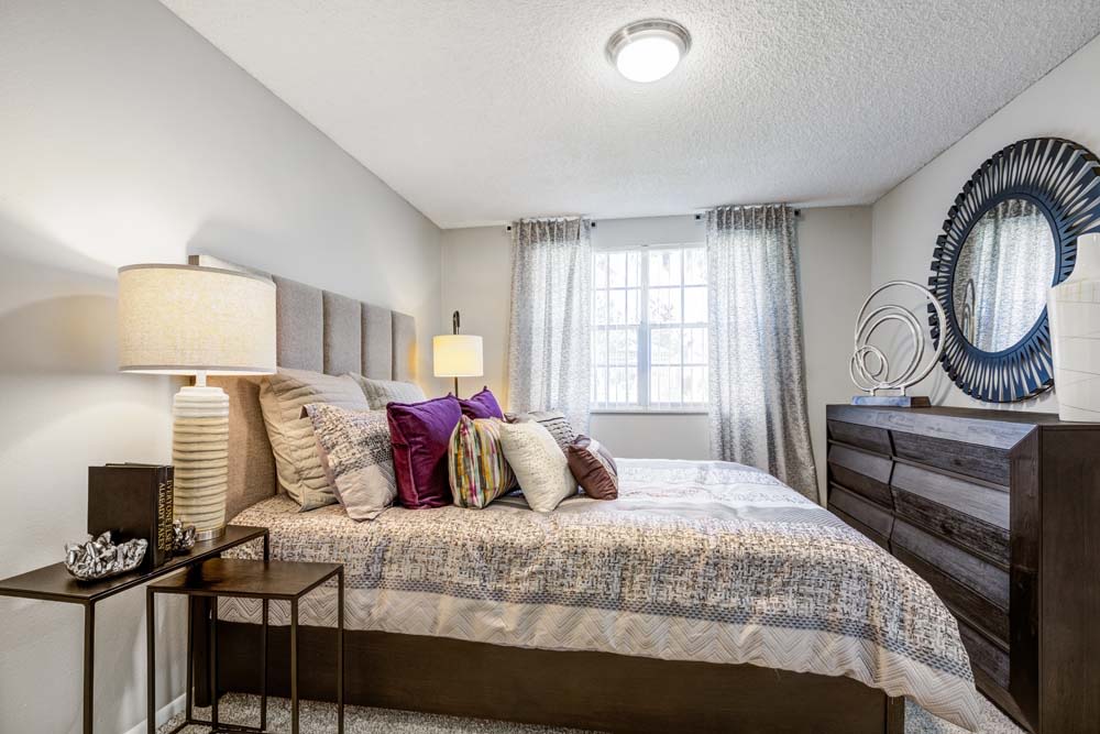 A luxury master bedroom at Ten 30 and 49 Apartments in Broomfield, Colorado