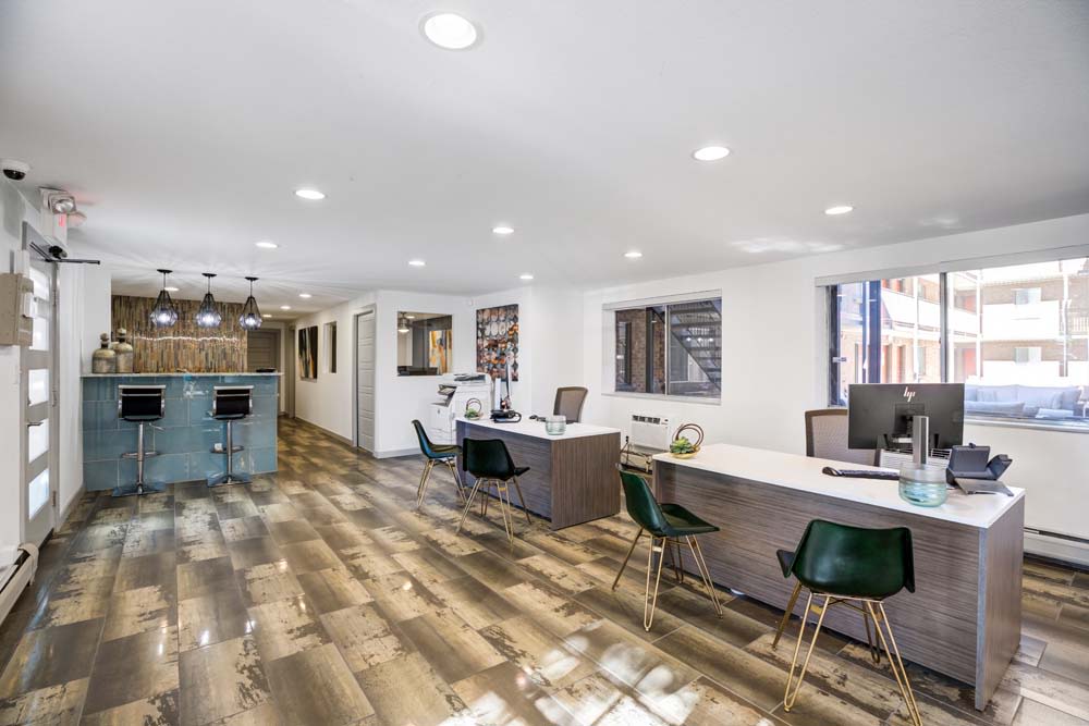 Another office room and bar with stools at Ten 30 and 49 Apartments in Broomfield, Colorado