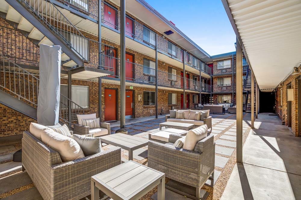 Lounge outdoors on cushioned seats at Ten 30 and 49 Apartments in Broomfield, Colorado