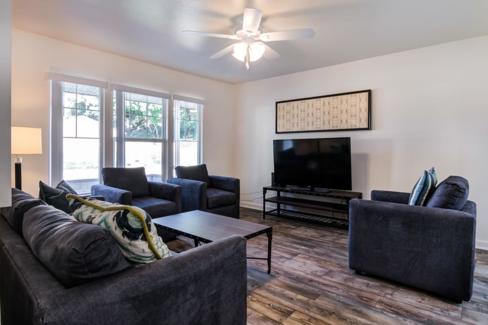 Furnished living room with wood flooring at Santo Terrace in San Diego, California