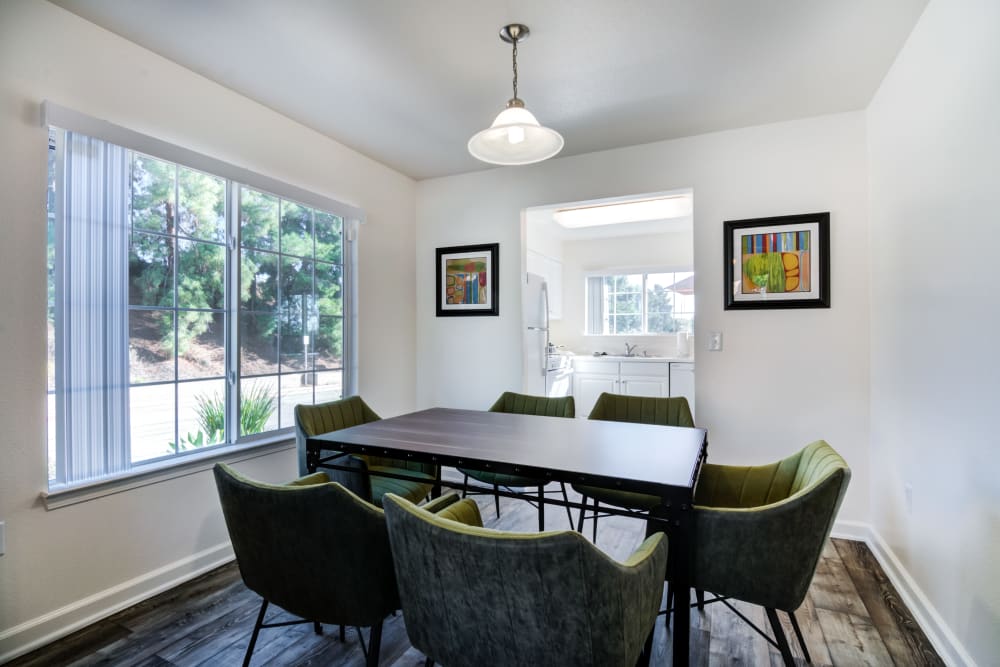 Well-lit and furnished dining area in a home at Santo Terrace in San Diego, California