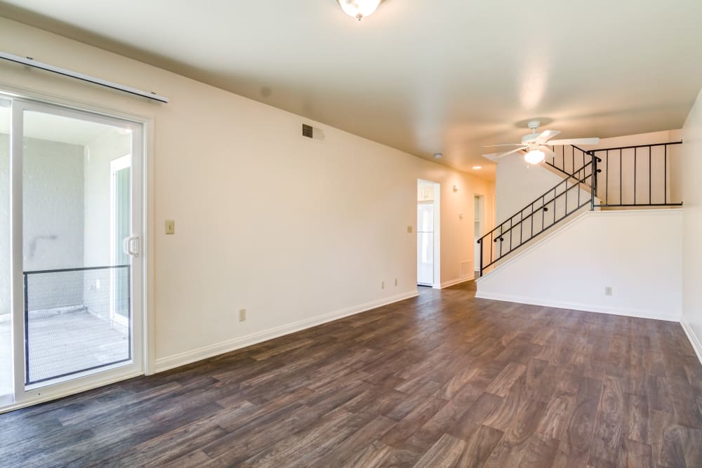 Spacious living area with wood flooring in a home at O'Neill Heights East in Oceanside, California