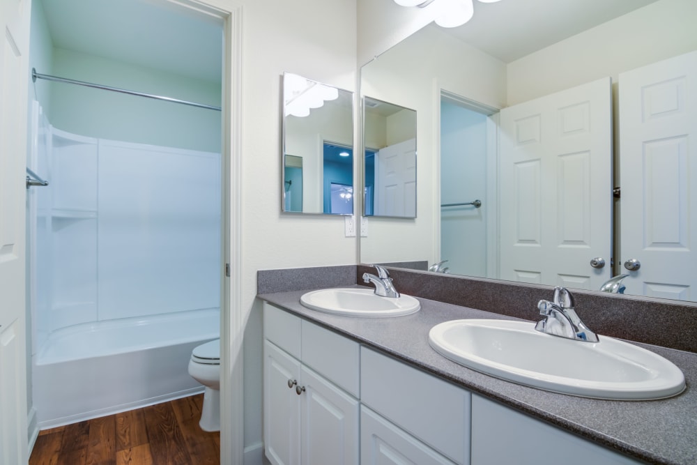 A bathroom with two sinks in a home at Harborview in Oceanside, California