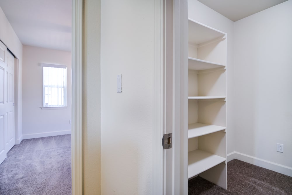 A closet with built-in shelving at Harborview in Oceanside, California