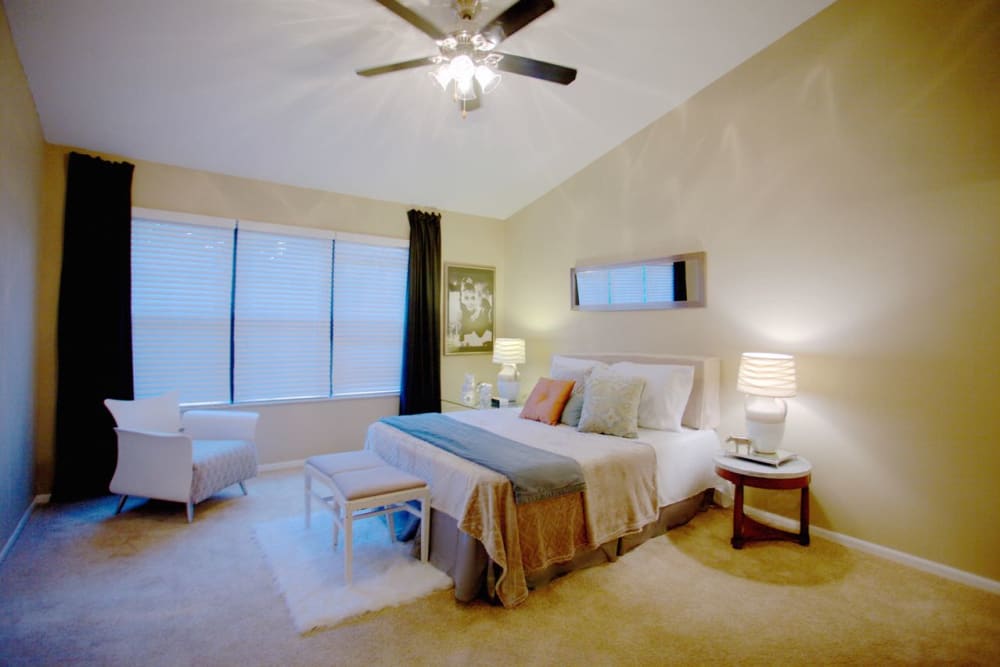 Model bedroom with vaulted ceiling and a ceiling fan at Lakeside at the Sanctuary in Columbus, Ohio