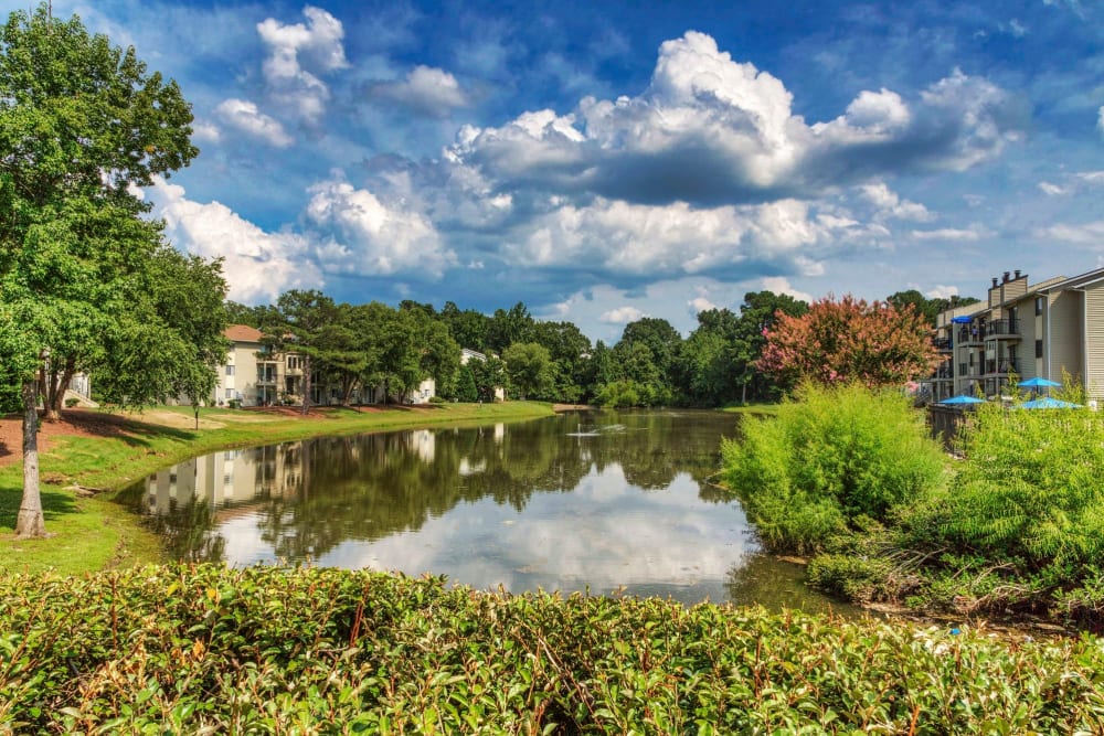 Beautiful view of The Village at Cliffdale Apartment Homes across the lake in Fayetteville, North Carolina