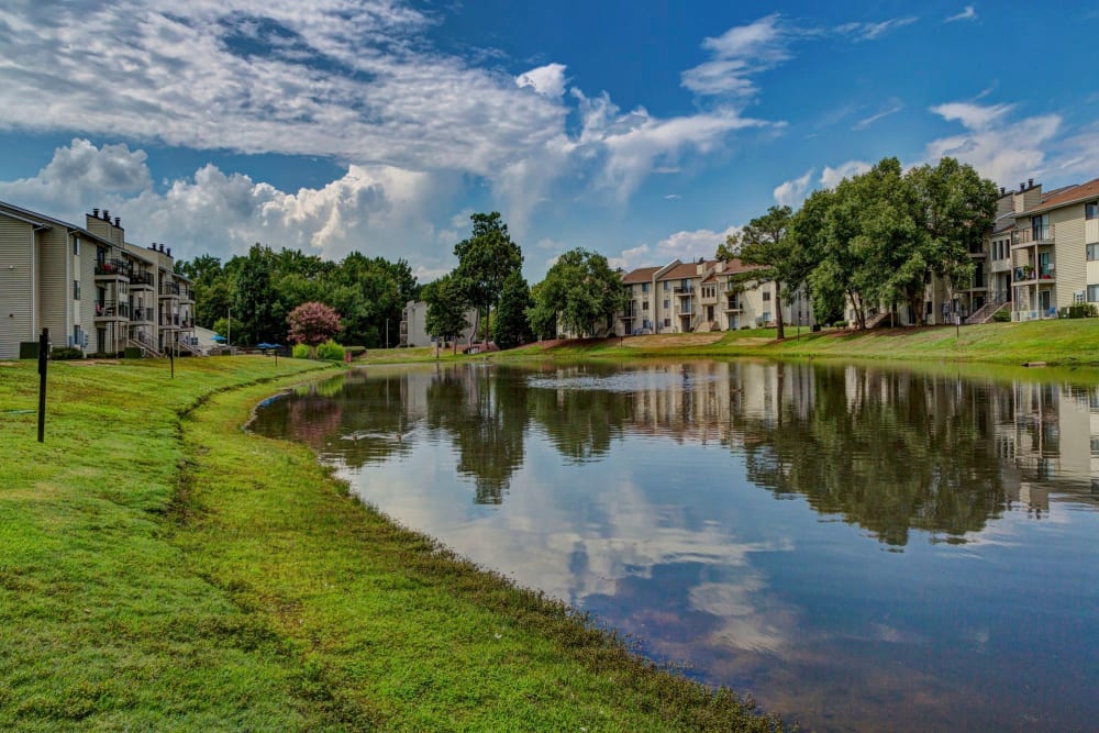 Lake and exterior view of The Village at Cliffdale Apartment Homes in Fayetteville, North Carolina