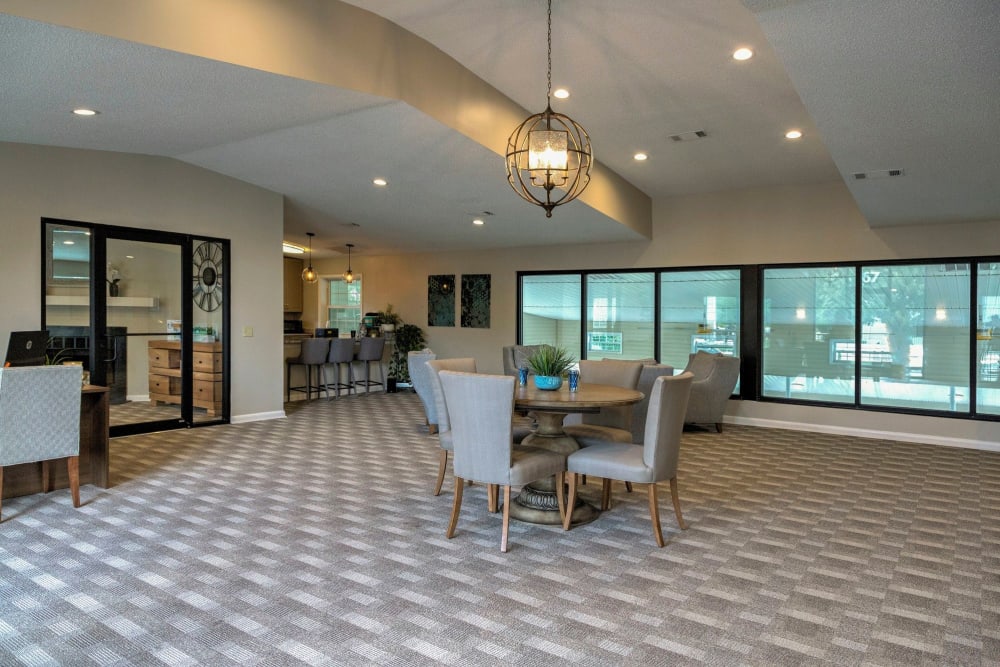 Resident clubhouse interior and indoor swimming pool at The Village at Cliffdale Apartment Homes in Fayetteville, North Carolina