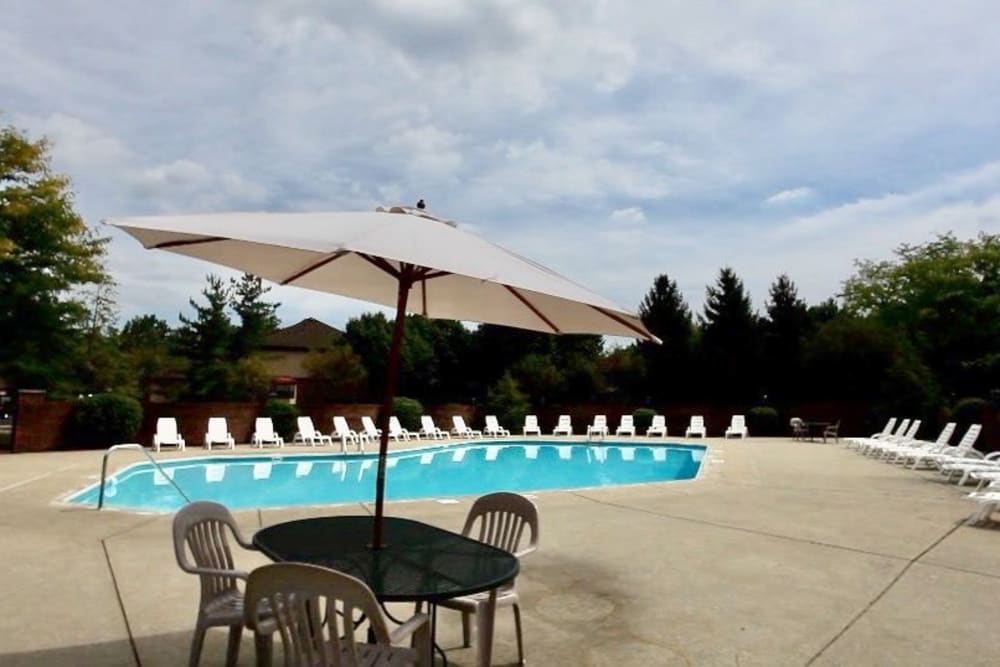 Sparkling swimming pool with sun deck at McNaughten Woods in Columbus, Ohio
