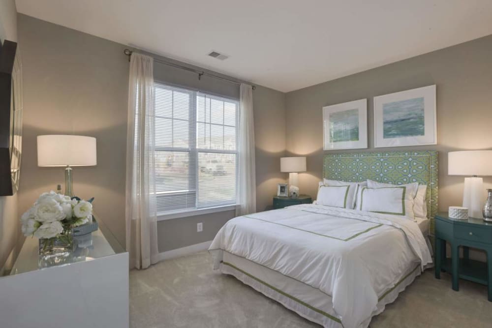 Model bedroom with large windows at Avanti Luxury Apartments in Bel Air, Maryland