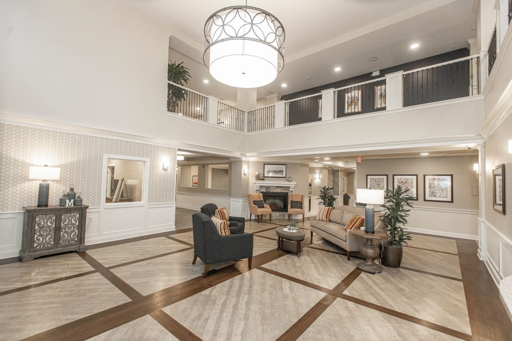 Common area with tall ceilings at The Madison Senior Living in Kansas City, Missouri