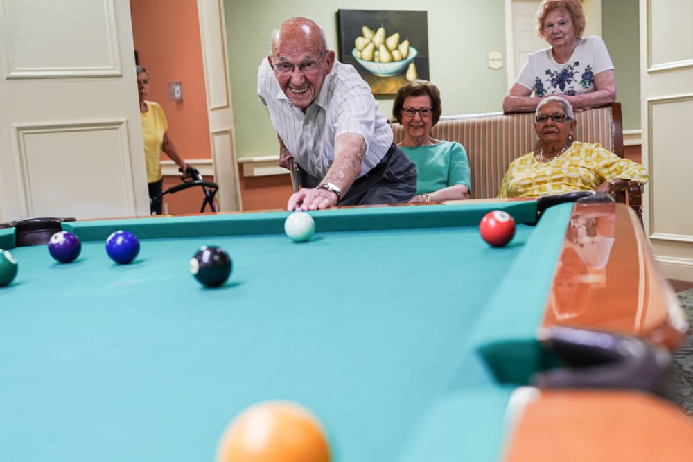 Residents playing pool Harmony at Harbour View in Suffolk, Virginia