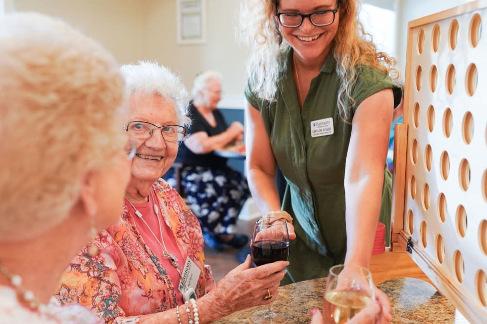 Residents playing games at happy hour at Harmony at Oakbrooke in Chesapeake, Virginia